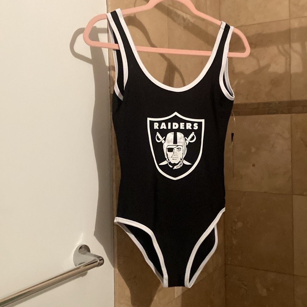 Swim suit one piece by NFL. Women’s medium black with white.